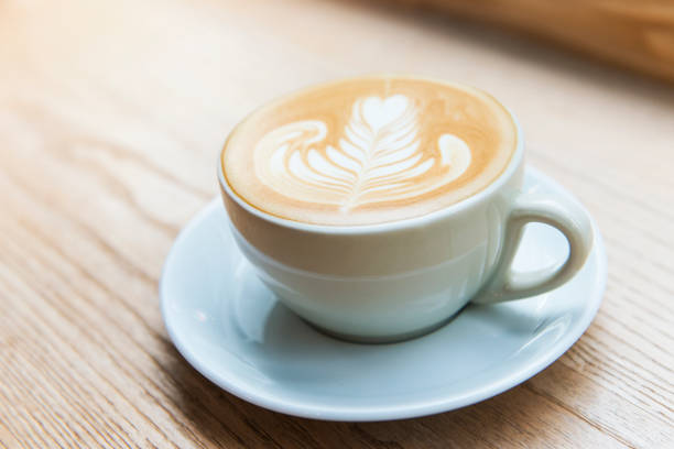 istock hot milk art coffee on wooden table 647872042
