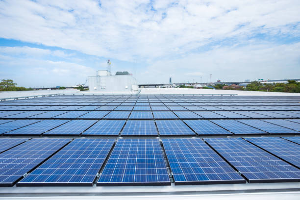 Solar panels on factory roof stock photo