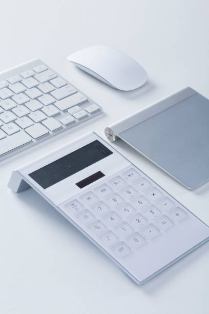 istock Modern White office desk table with keyboard, mouse, calculator,and wacom 647878974