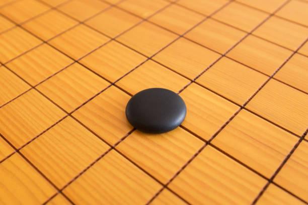 istock Go game or Weiqi (Chinese board game) background 647879234