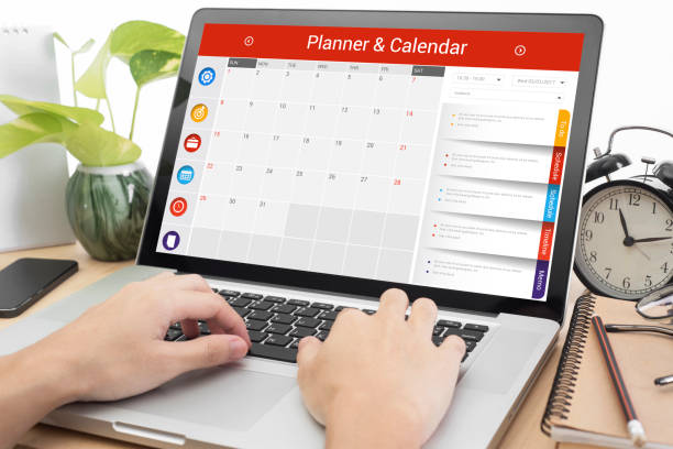 istock business hand typing on a laptop keyboard with Calender Planner 647957172