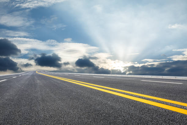 istock Asphalt road and sky at dusk 647957370