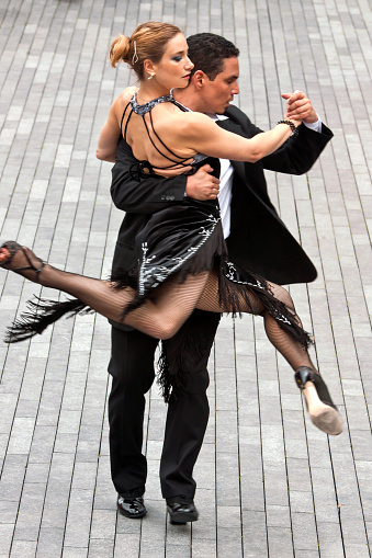 A Tango Dance exhibition was part of the Mayor's Thames Festival in September 2011 in London.  This outdoor performance along the south bank of the Thames was free to the public.  in this photo, a pair of dancers demonstrate their skills.