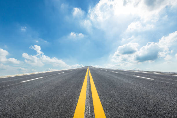 istock asphalt road under the blue sky 647959348