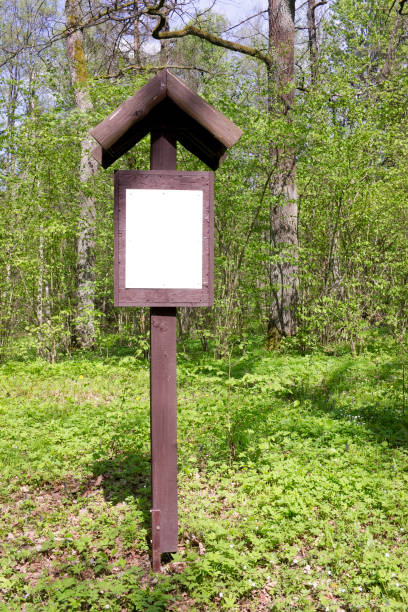 istock Forest wooden red informatioin sign with empty area 647968090