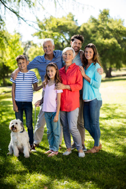 istock Happy family enjoying in park 647971130