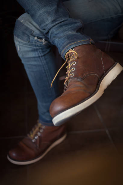 istock brown boot leather shoes and jean pants clothing 647974630