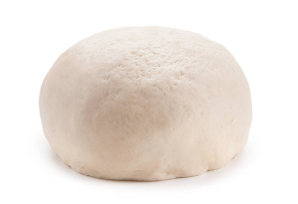 istock fresh raw dough ball isolated on white background 647975268