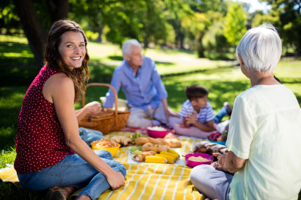 istock Happy family enjoying in park 647975616