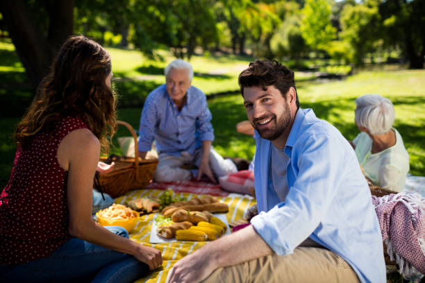 istock Happy family enjoying in park 647977836