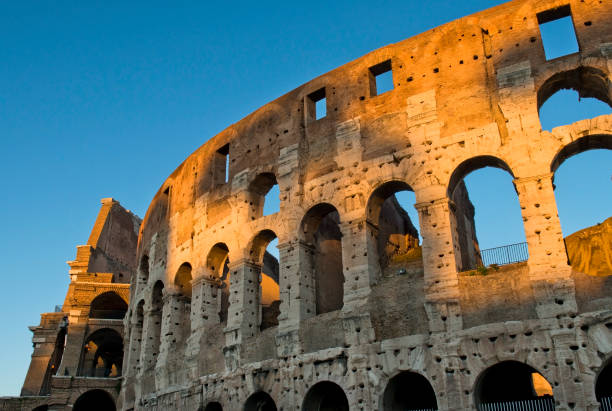 istock magnificent Colosseum in the first rays of sun 647977880