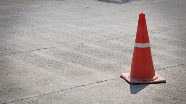 istock traffic cone on street used warning sign on road 647978196