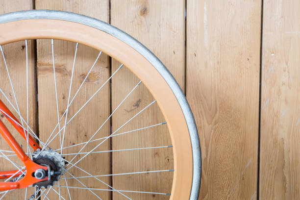 istock bicycle parked with wood wall, close up image part of bicycle 647978232