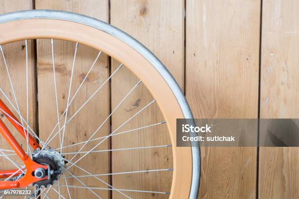 Bicycle Parked With Wood Wall Close Up Image Part Of Bicycle Stock Photo - Download Image Now