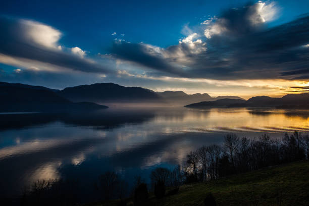 Full moon over a fjord