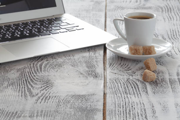 istock Workplace with laptop and coffeecup on white 647985892