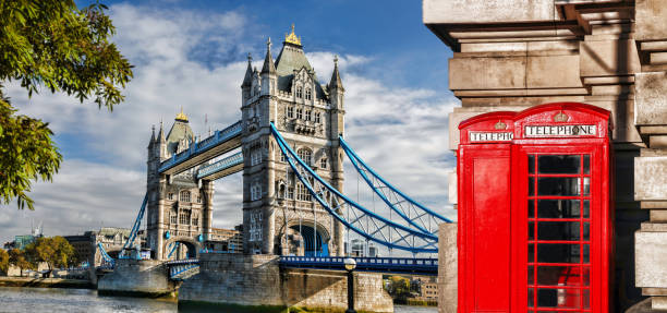 tower bridge with red phone booths in london, england, uk - england telephone telephone booth london england imagens e fotografias de stock