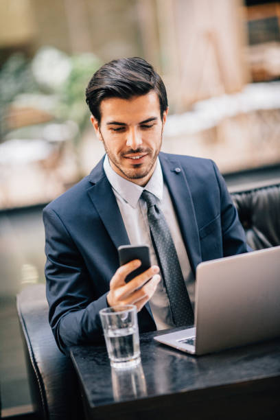 istock Businessman texting at the cafe 647986802