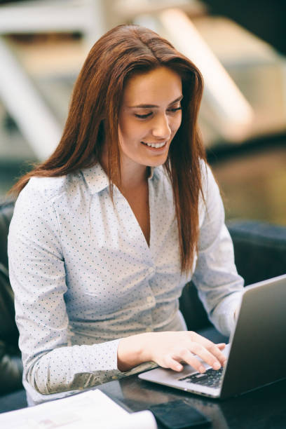 istock Woman at an internet cafe 647986818