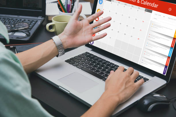 istock business hand typing on laptop keyboard with Calender Planner homepage 648001896
