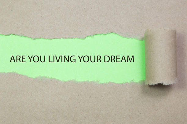 istock are you living your dream written under torn paper 648005142