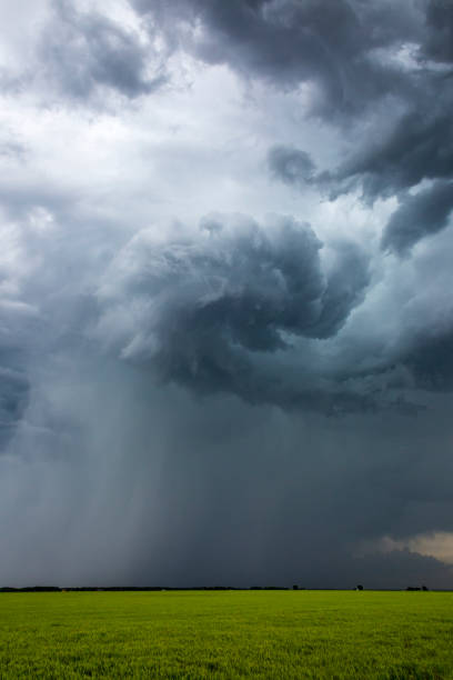 istock Severe, rotating storm clouds with torrential rain shaft 648009180