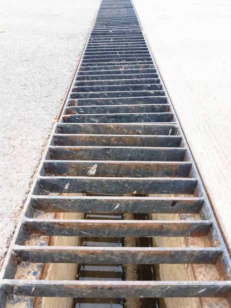 istock long steel rails cover the sewerage hole 648021738