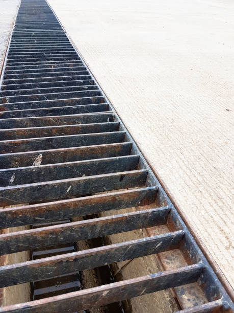 istock long steel rails cover the sewerage hole 648025038