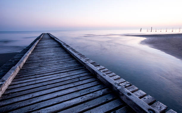 istock Wooden jetty on the beach 648025372