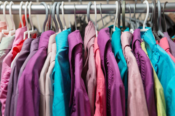 istock Clothes hang on a shelf in a designer clothes store 648025422