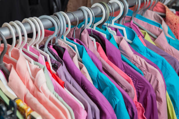 istock Clothes hang on a shelf in a designer clothes store 648027894