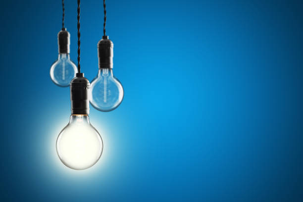 istock Idea and leadership concept Vintage incandescent Edison bulbs on color background 648038596