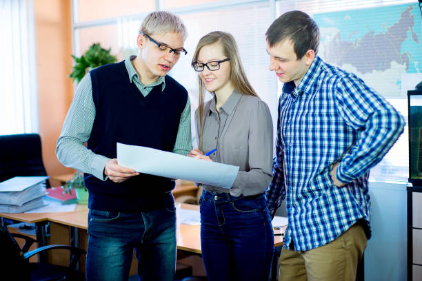 istock discussion of workers at the desk business ideas 648040172