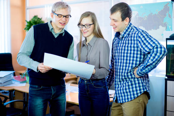 istock discussion of workers at the desk business ideas 648040308