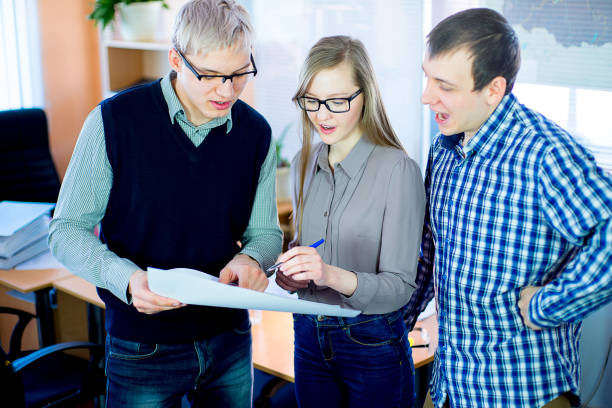 istock discussion of workers at the desk business ideas 648042516