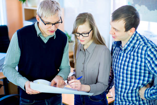 istock discussion of workers at the desk business ideas 648042566