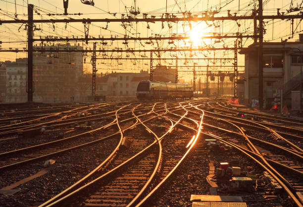 Sunrise railroad Trains on the railroad tracks of Perrache station, Lyon, during sunrise. railway signal stock pictures, royalty-free photos & images