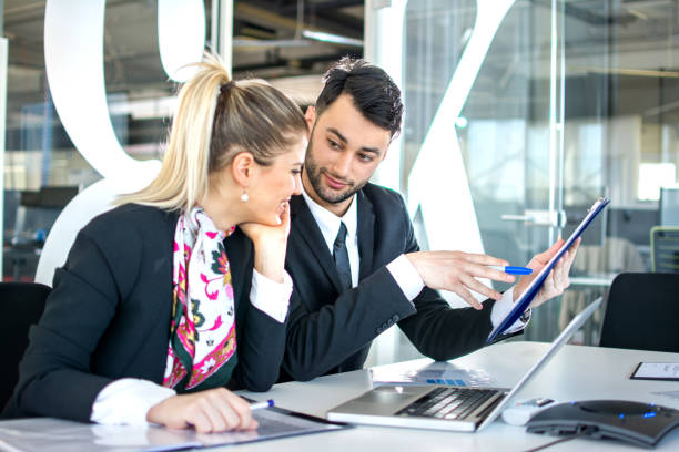 istock Young business people working together in office. 648046606