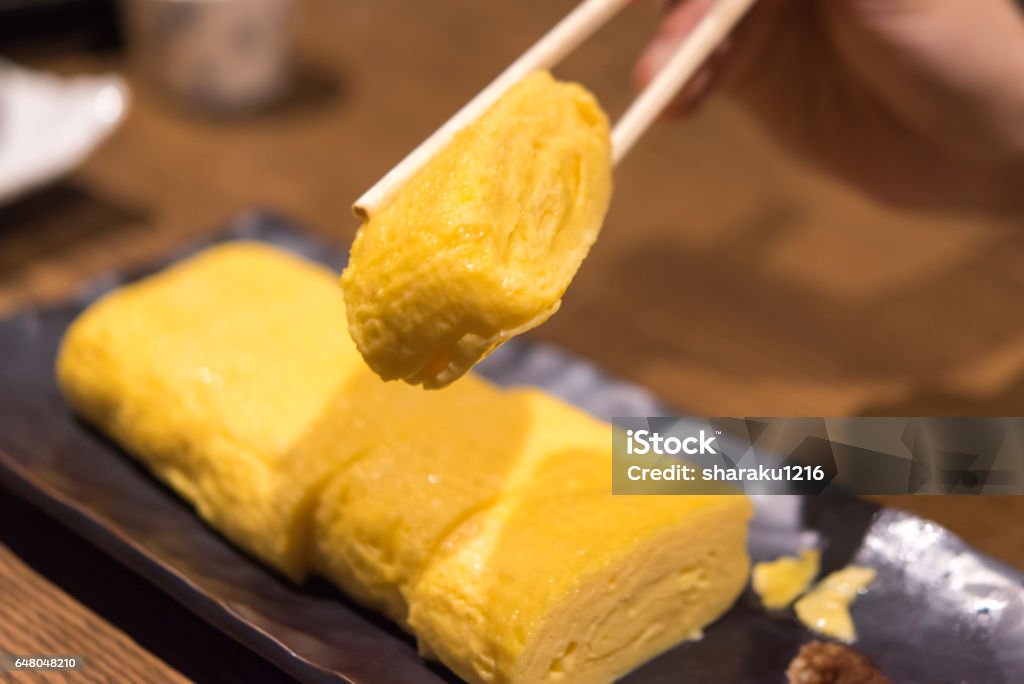 Egg grilling It is an egg dish. Chopsticks Stock Photo