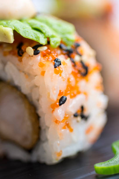 istock Fresh Sushi Rolls Served on Dark Stone Plate 648050556