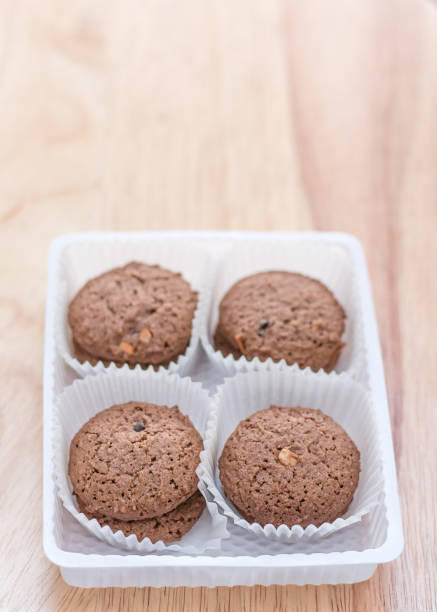 istock Cookies chocolate in plastic box on wooden background 648050850