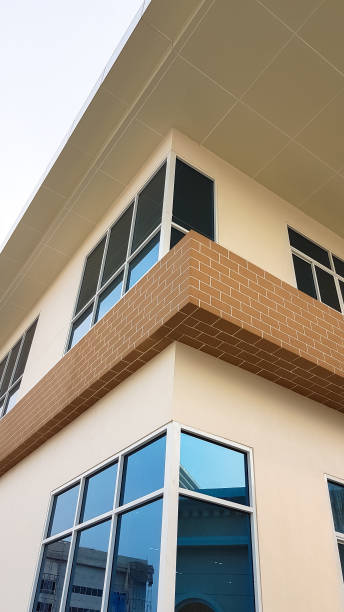 istock beautiful concrete building with long mirror , decorate with brown brick 648051142