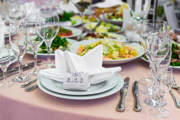 istock catering table set service with silverware, napkin and glass at restaurant before party 648061864