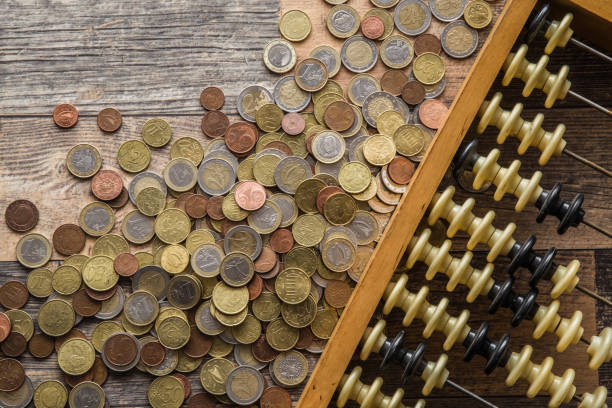 istock Money on the table. Euro coins from different countries. 648065300