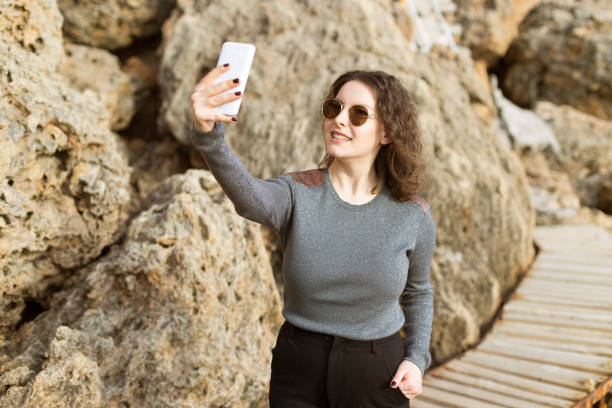 istock Cute turkish girl with smile selfie 648065840