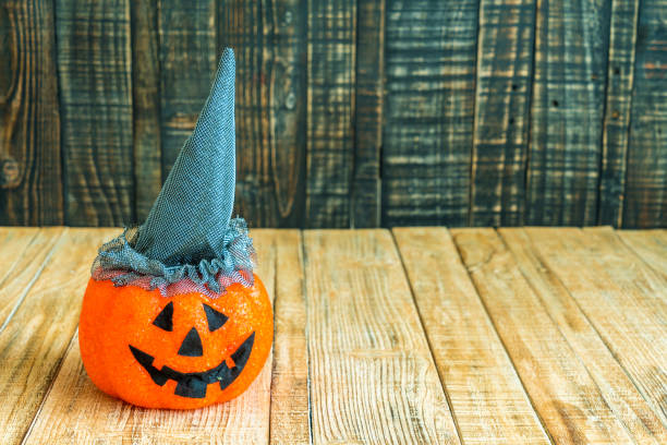 istock Halloween pumpkin head jack lantern on wooden 648072592
