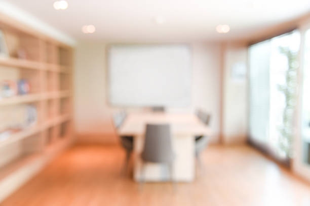 istock abstract blur office meeting room interior for background 648073980