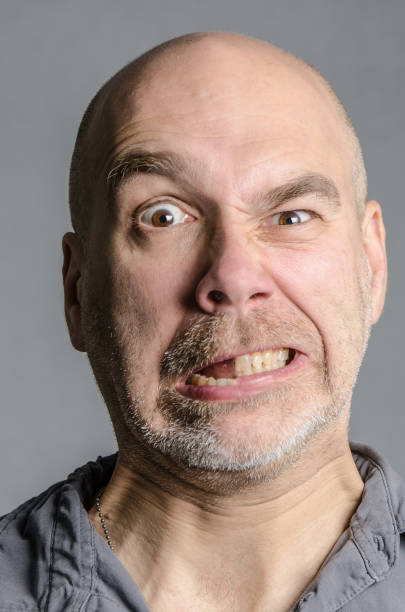 istock Man with double emotion: fear and anger 648077226