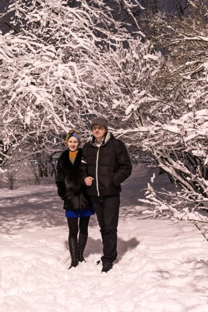 istock Couple in winter park 648081058