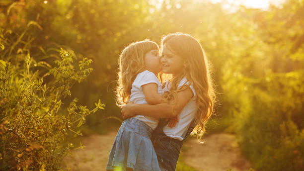 istock Two cute little sisters big hug. 648081338